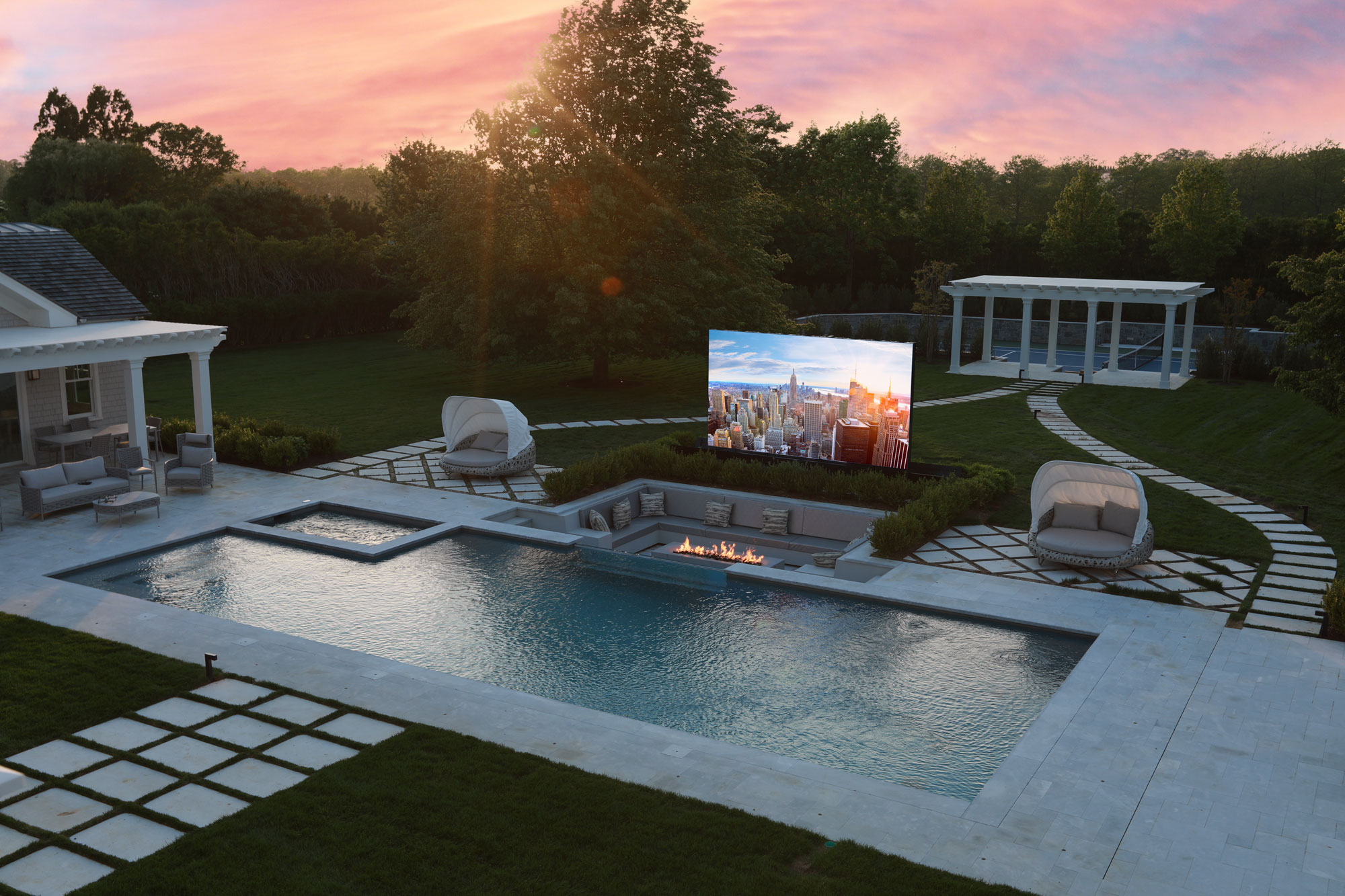 LED screen emerges from ground next to pool in outdoor entertainment area