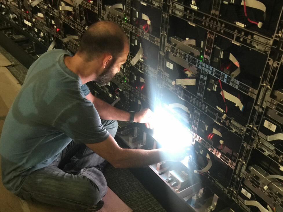 Engineer working on LED wall